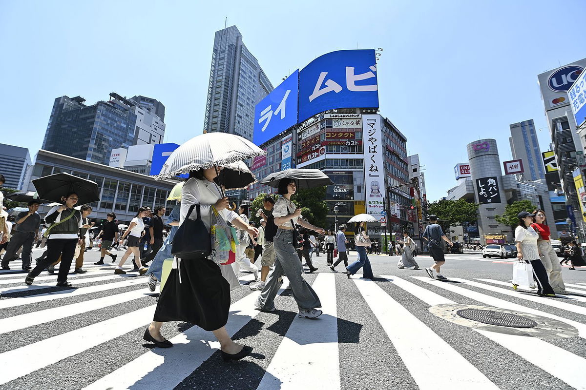 <i>David Mareuil/Anadolu/Getty Images via CNN Newsource</i><br/>People cross the iconic Shibuya crossroads on June 17 in Tokyo